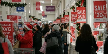 Shoppers enthusiastically browse holiday sales in a brightly lit US retail store, 2025.